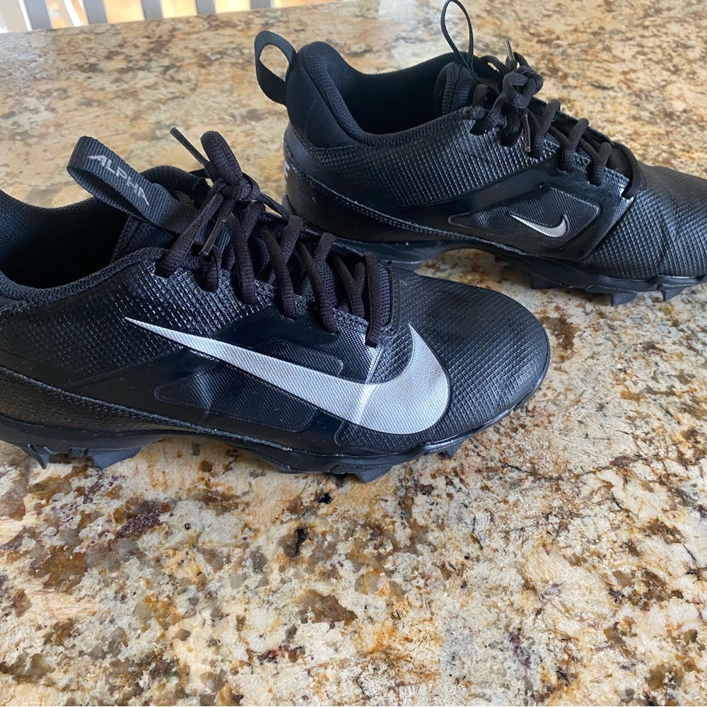 Nike Black Cleats with Silver Swoosh Accents